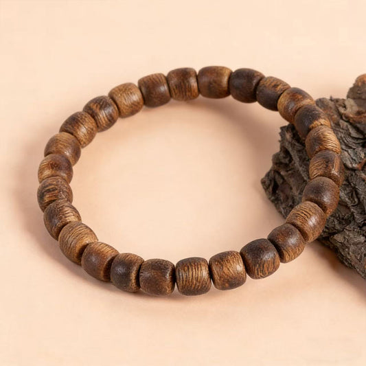 Kyara Adlerholz Armband 6mm Trommelperlen | Tonnenförmig | Naturharzreich | Glatt poliert | Traditioneller Stil